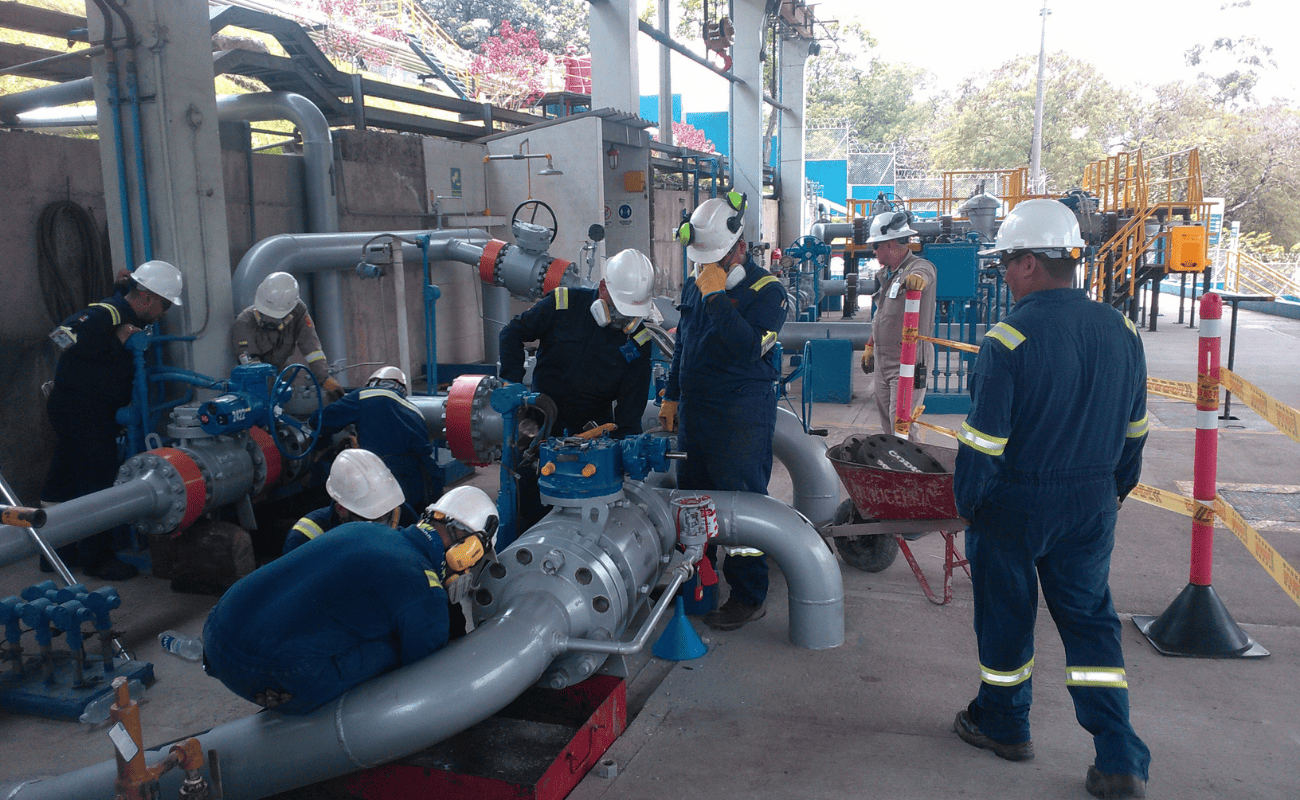 OBS crew working on the manifold of a pumping system