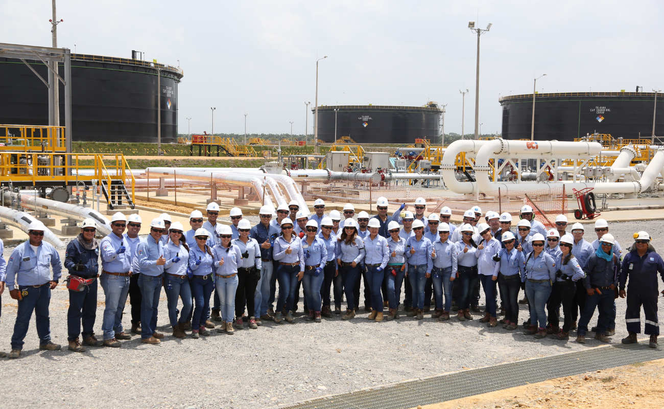OBS work team at a station with storage tanks
